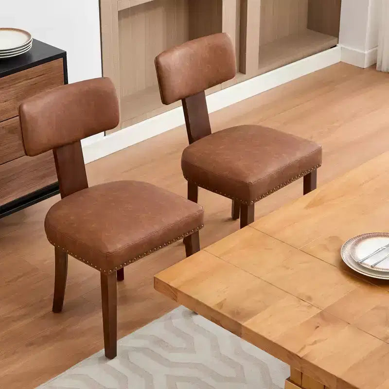 Deux chaises de salle à manger en lot, en cuir moderne, structure en bois, capacité de charge de 120 kg, facile à nettoyer, dossier incurvé.
