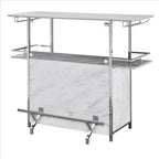 Table de bar Royal Hampton avec plateau aspect marbre et finition chromée, blanc et argent